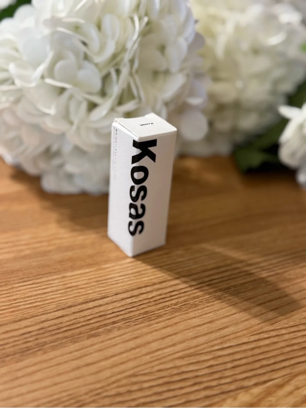 Kosas White Packaging with Black Logo Weightless lip color Darkroom Beauty